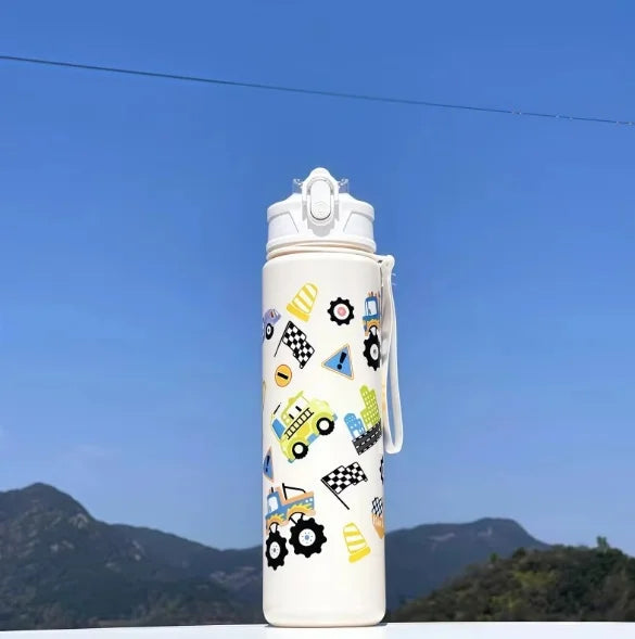 DinoSip Kids Water Bottle with playful car and construction patterns against a clear blue sky.