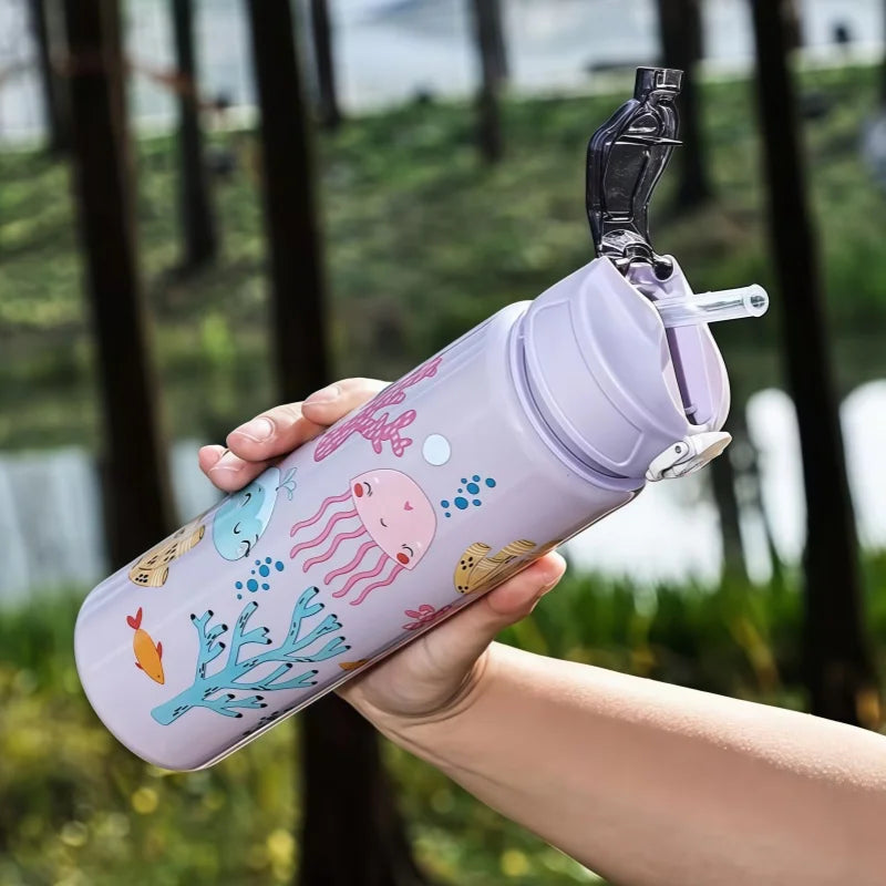 DinoSip Kids Water Bottle with colorful ocean design and soft straw for easy sipping.