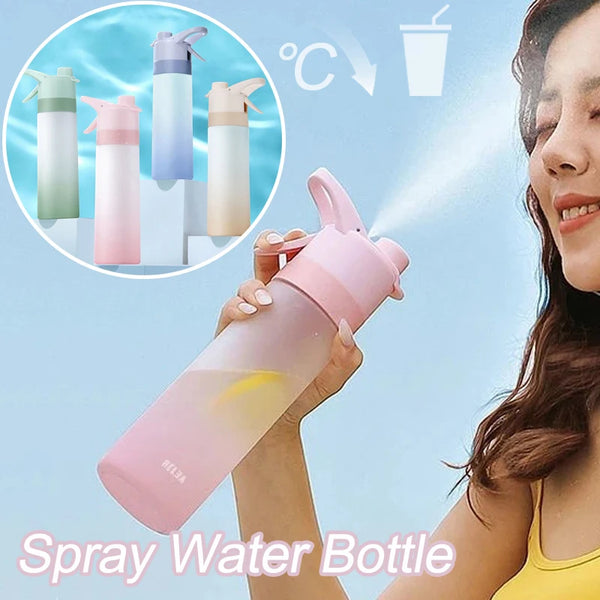 Woman using a HydroMist cooling mist water bottle for hydration and refreshing mist during outdoor activities.