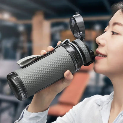Portable BPA-Free Sports Water Bottle in use, showcasing easy one-click drinking and sleek design for hydration.