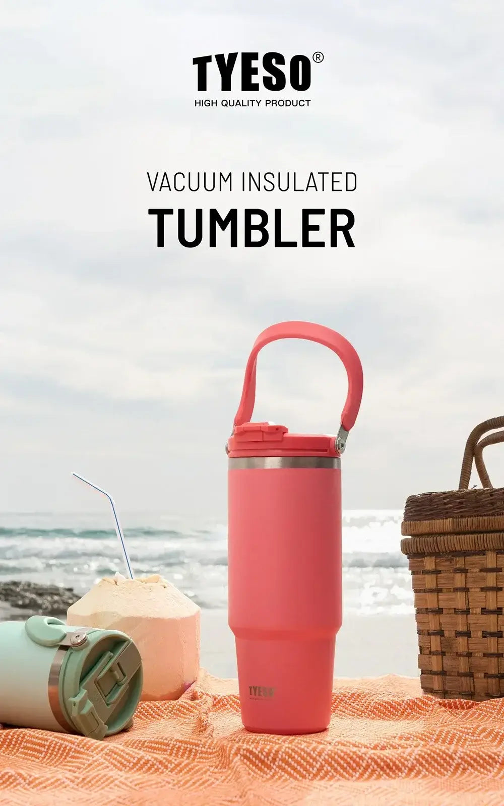 Insulated tumbler with dual-drink lid against beach backdrop, featuring handle and vibrant design.