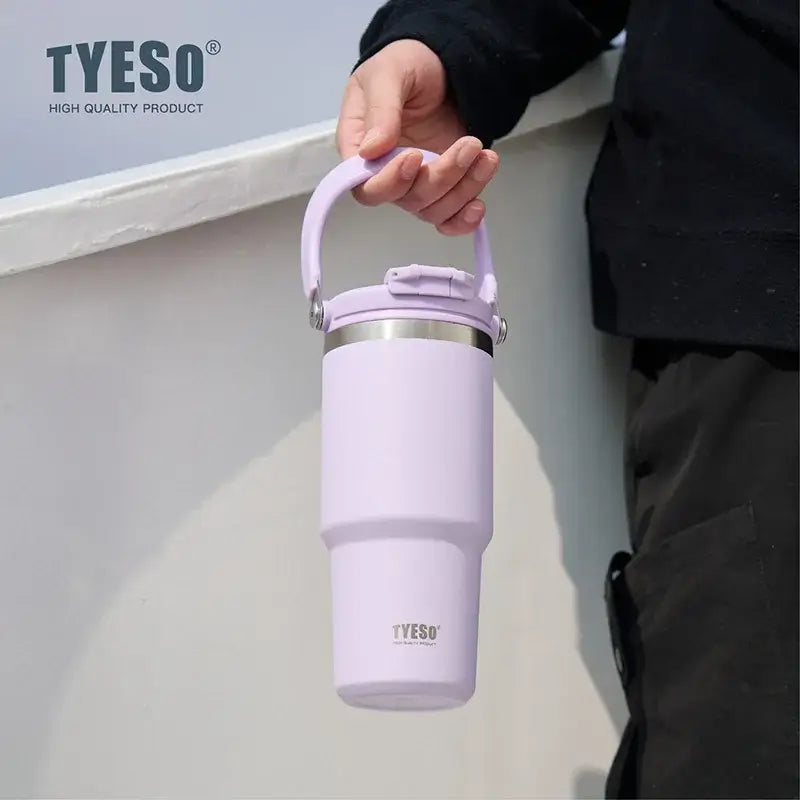 Insulated tumbler with dual-drink lid in pastel purple color, ideal for hydration on the go.