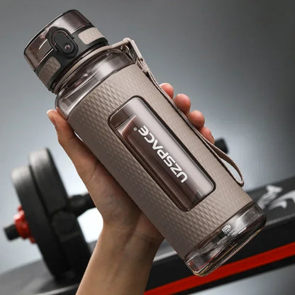 Portable BPA-Free Sports Water Bottle in hand, showcasing its lightweight and leak-proof design.