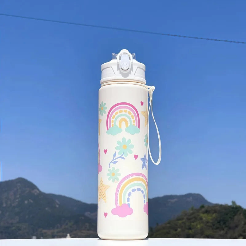 DinoSip Kids Water Bottle with colorful rainbow design against a clear blue sky, ideal for hydration adventures.