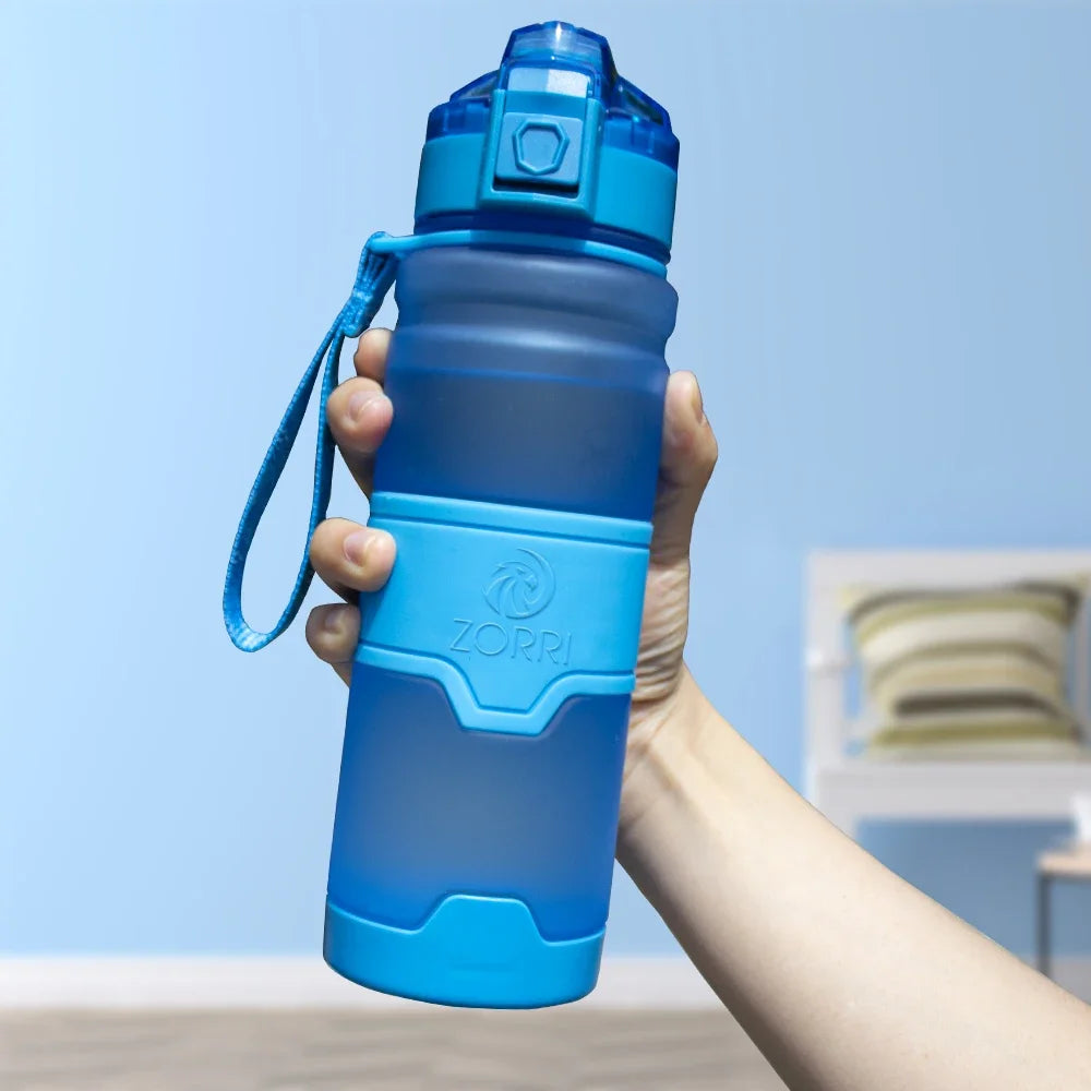HydroLock Sport Bottle held in hand featuring a vibrant blue color and convenient strap for easy carry.